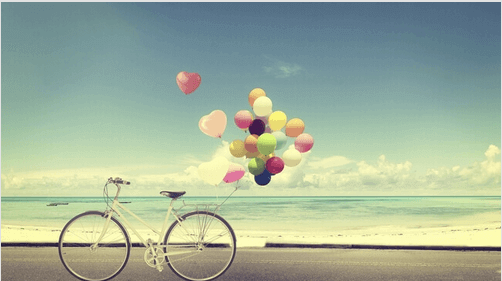 bicicleta-con-globos-playa