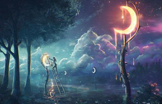 femme en train d'accrocher des lunes dans les arbres