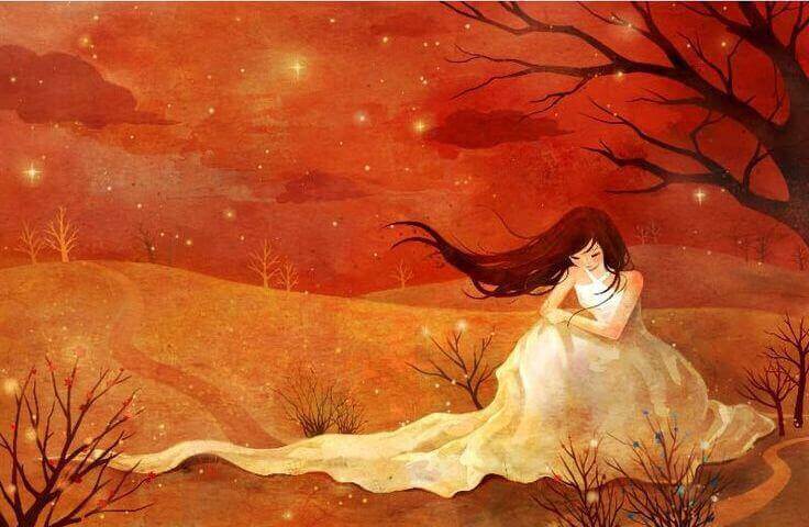 Mujer-triste-y-sola-sentada-junto-a-un-arbol