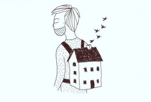 homme qui porte une maison